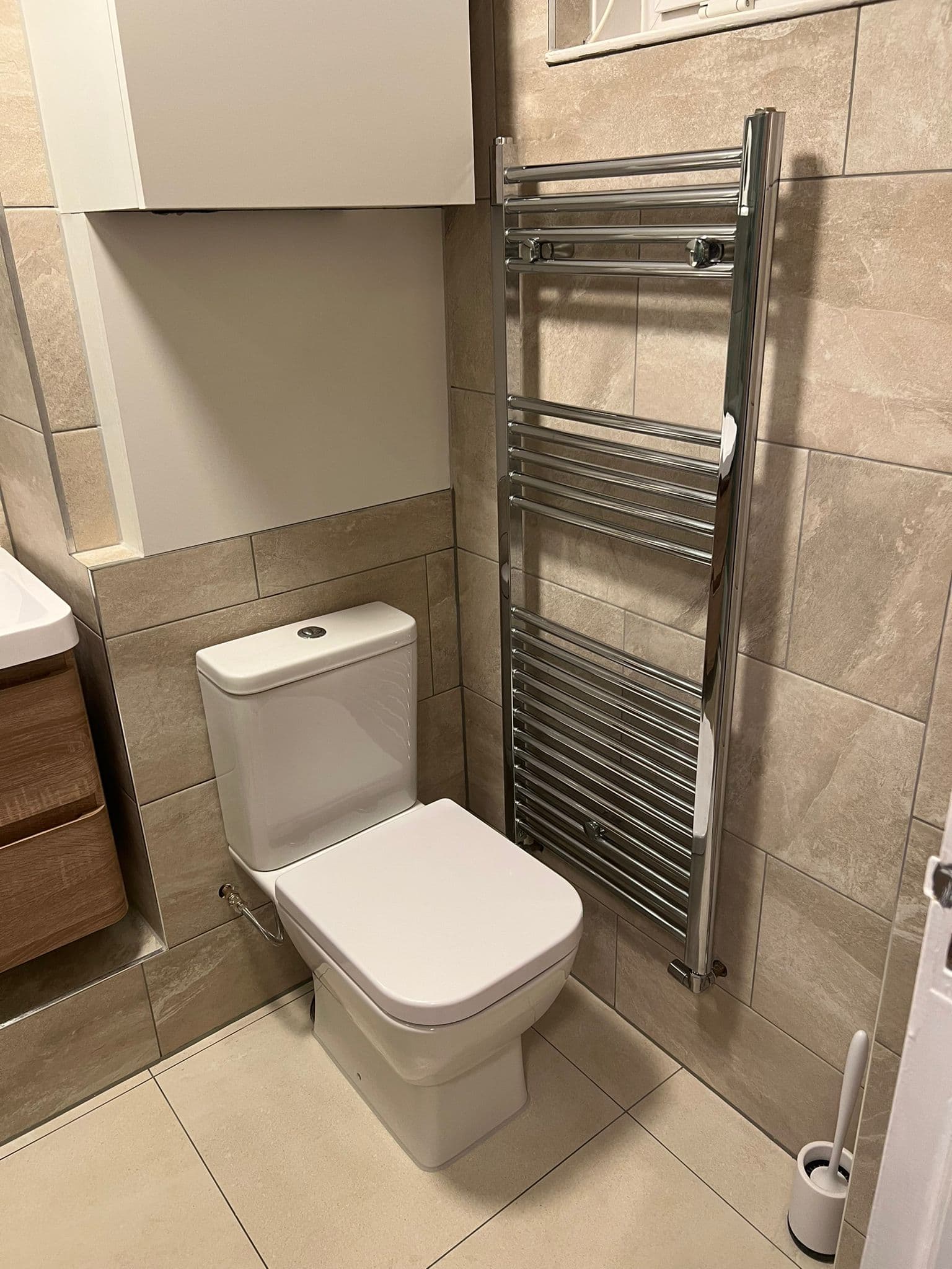 Bathroom Renovation in Battersea: Close-coupled toilet and the chrome heated towel rail