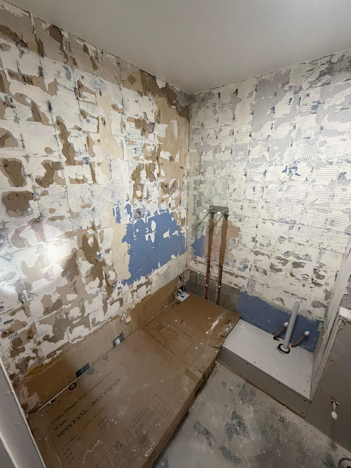 Bathroom Renovation in Battersea: Stripped back to the walls, with the new tray still boxed