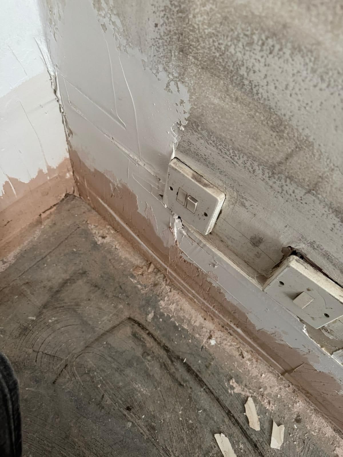 Full Property Refurbishment in Hammersmith: Damaged wall finishes around the old sockets