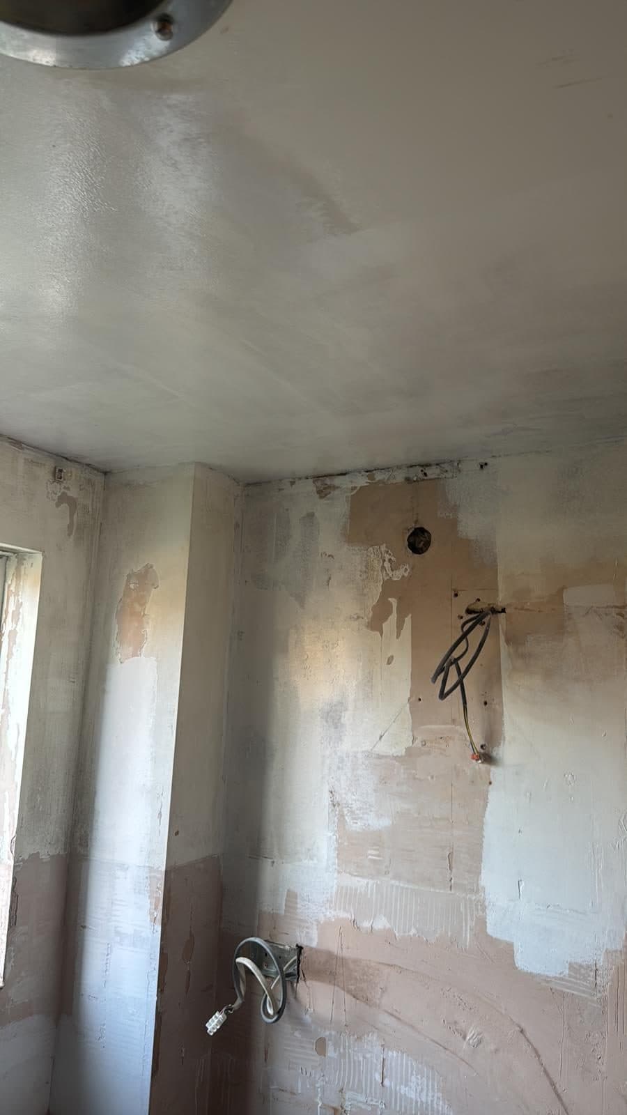 Full Property Refurbishment in Hammersmith: Walls made good, with pipework and cables left ready for fitting
