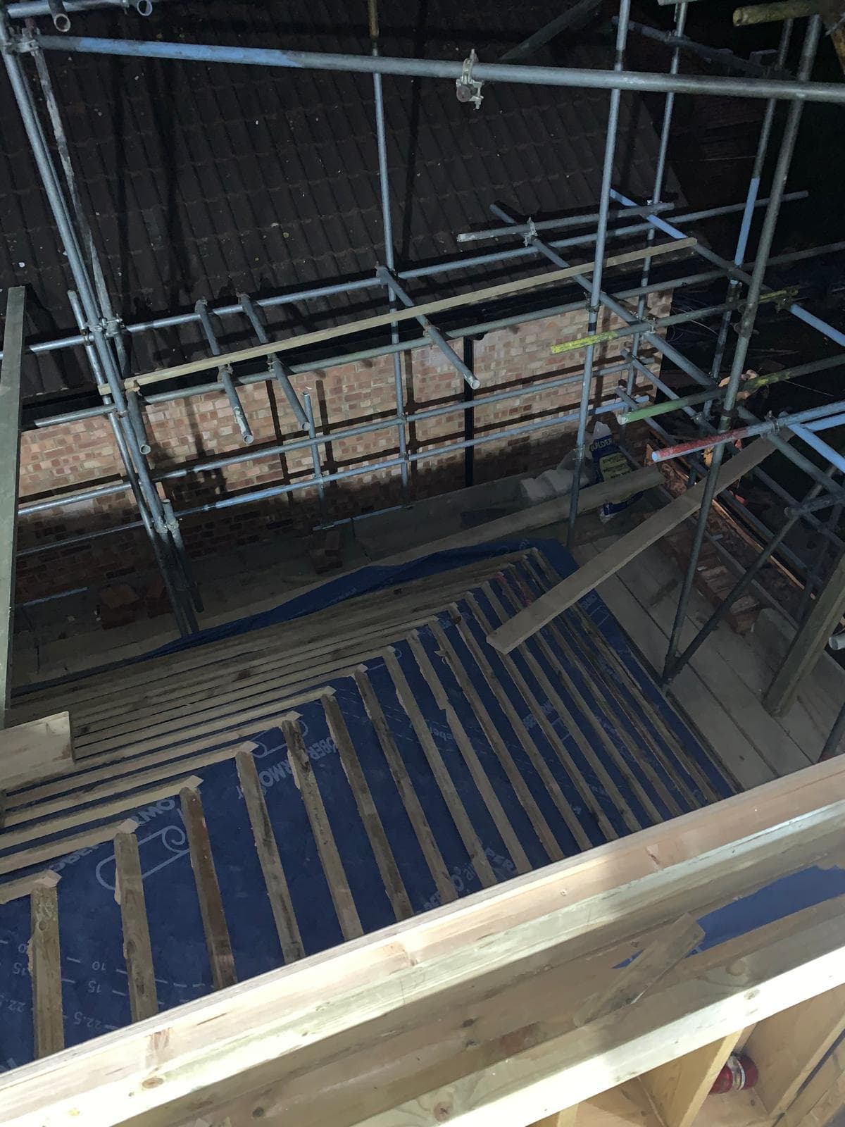 Full House Renovation in Chiswick: Loft floor joists going in above the party wall