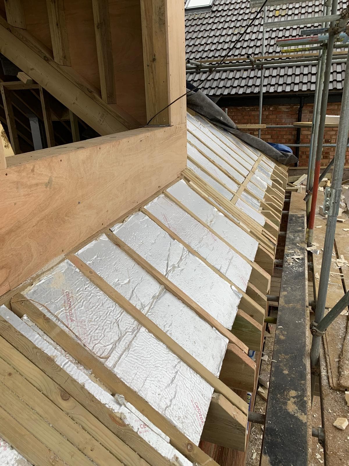 Full House Renovation in Chiswick: Insulation fitted between the new rafters