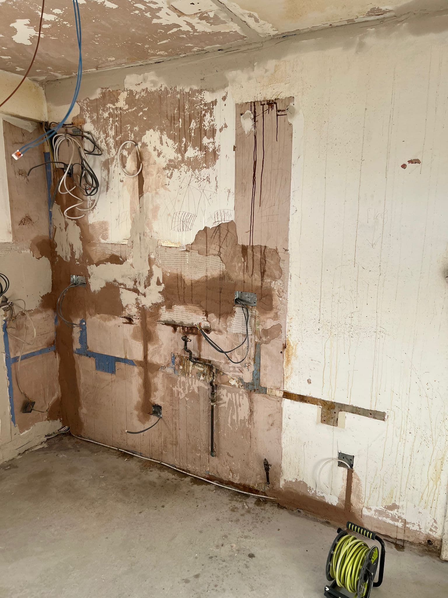 Navy Shaker Kitchen in Mayfair: New circuits chased into the wall