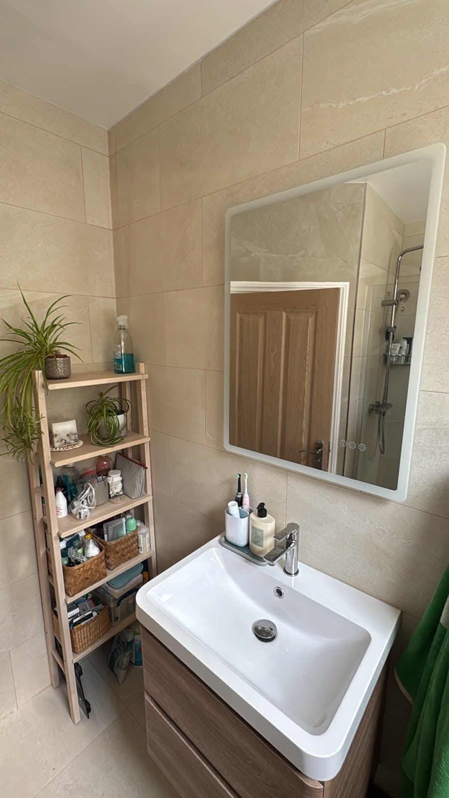 Bathroom Layout Transformation in Tooting: Basin on a wood-effect vanity unit, with a mirror above